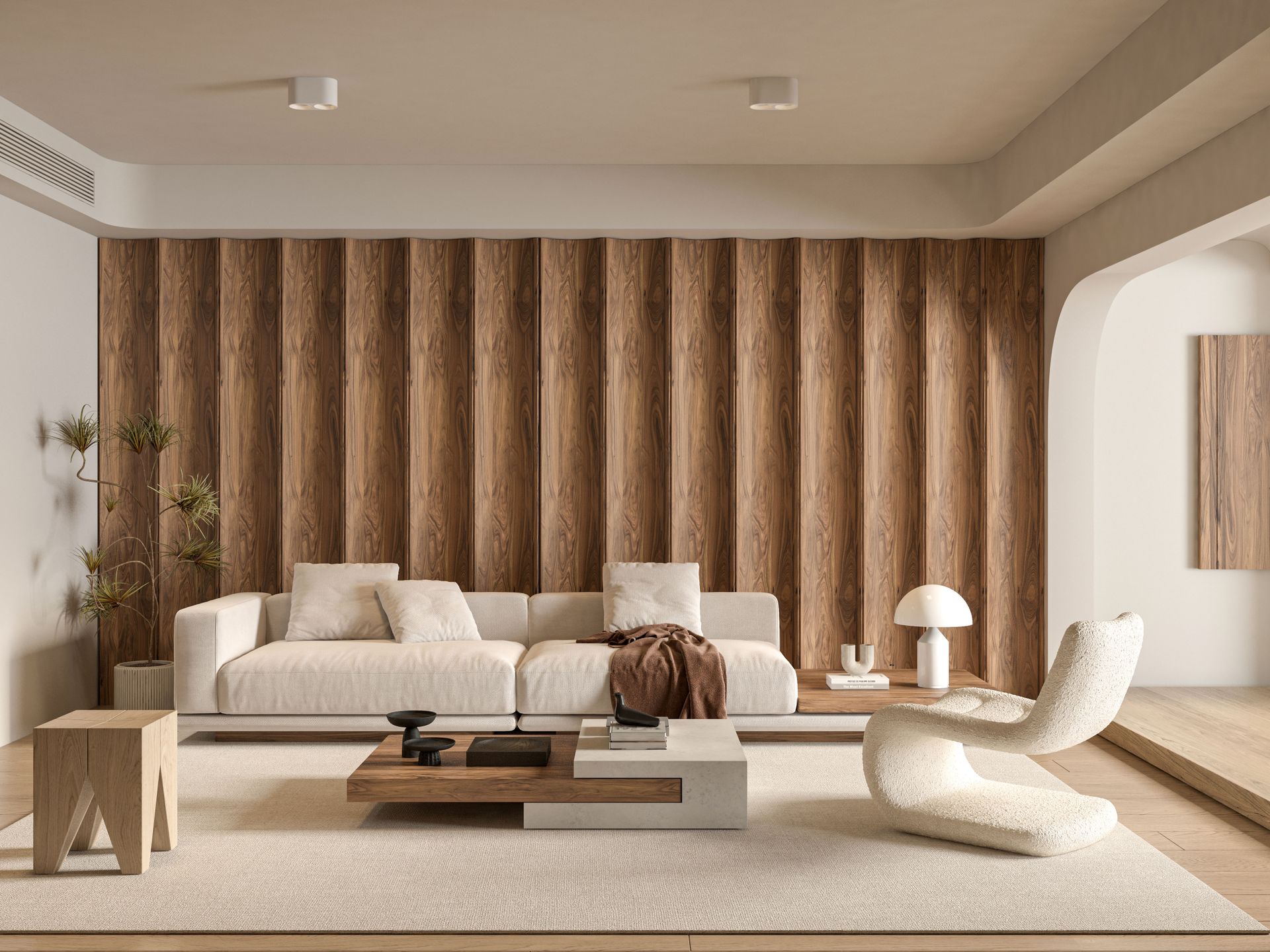 Open-plan living room of a renovated home with bespoke joinery and warm natural light