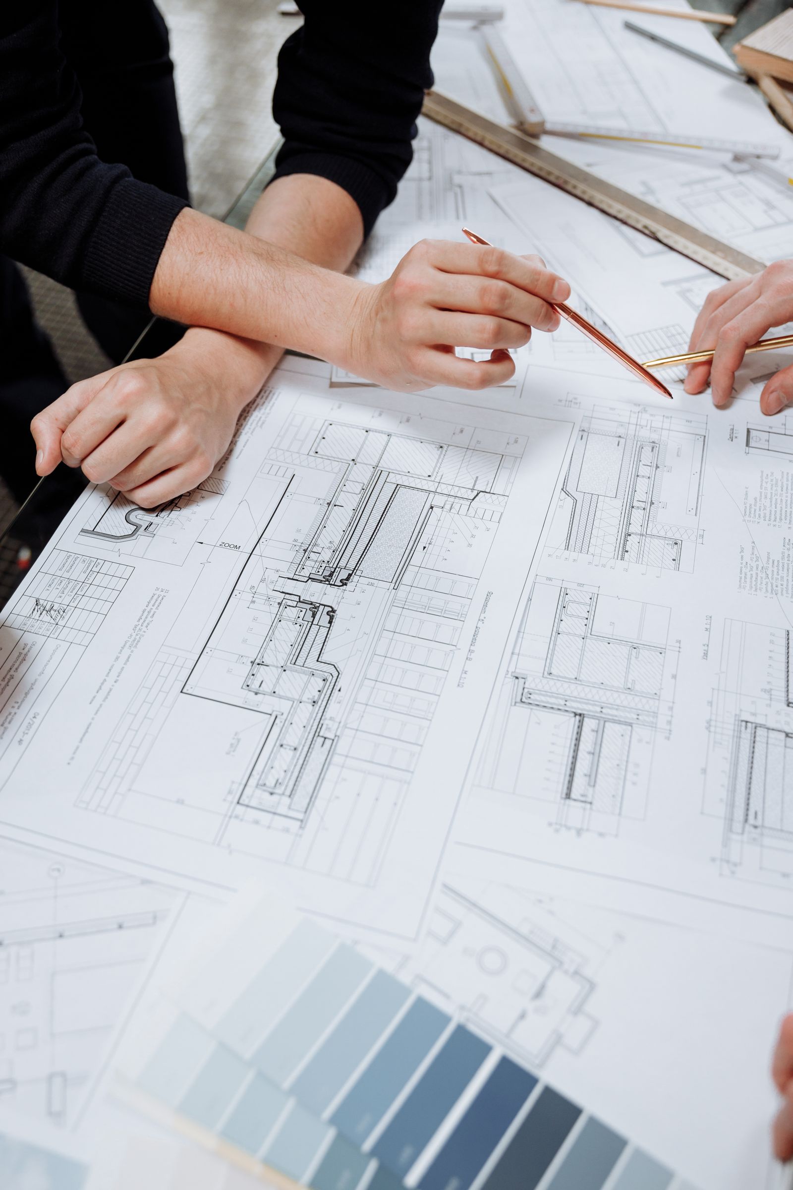 Designers reviewing plans during an initial home consultation