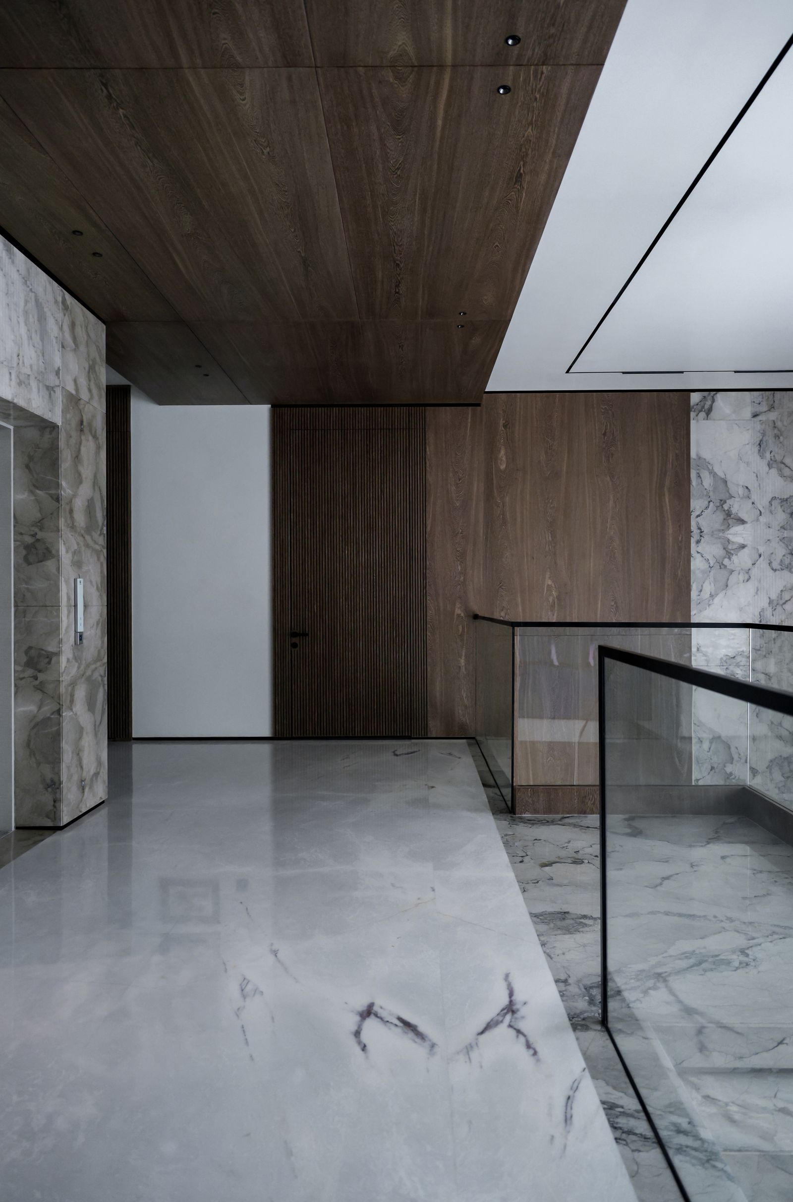 Showroom interior lined with marble and timber panelling